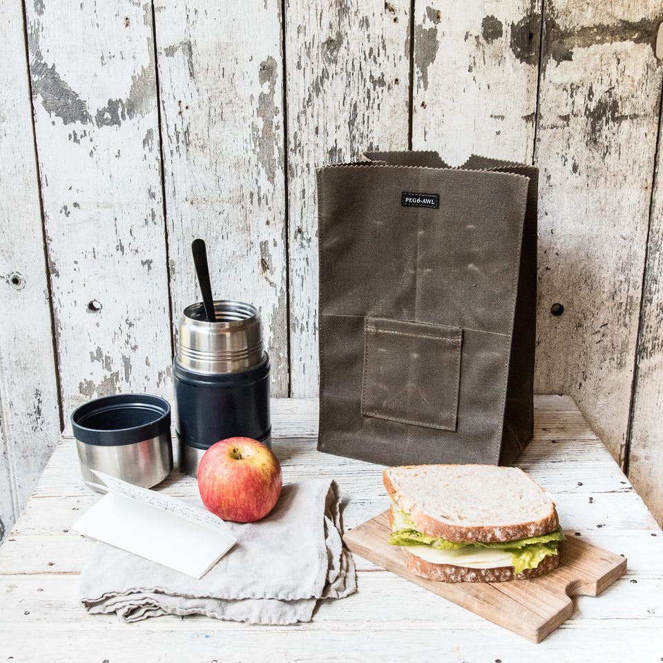 https://pegandawlbuilt.com/cdn/shop/products/Lunch-Bag-Container-Waxed-Canvas-Truffle-Brown-Peg-And-Awl_08_960x960.jpg?v=1699583938