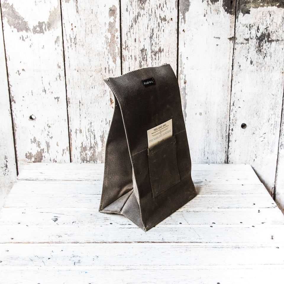 https://pegandawlbuilt.com/cdn/shop/products/Lunch-Bag-Container-Waxed-Canvas-Truffle-Brown-Peg-And-Awl_09_960x960.jpg?v=1699583643
